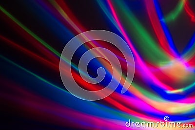 Multicoloured lines of light against a dark background Stock Photo