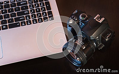 DSLR camera and laptop Stock Photo