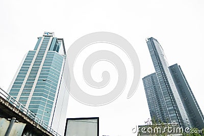 Dtac glass buildings in Bangkok city with blue sky background showing its design and traffic. Bangkok, Thailand April 14, 2018 Editorial Stock Photo
