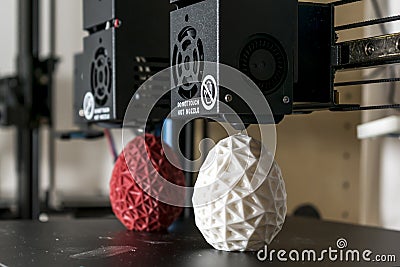 Dual extruder 3d printer which finished printing two bicolor egg model, idex technology Stock Photo