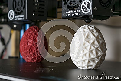 Dual extruder 3d printer which finished printing two bicolor egg model, idex technology Stock Photo