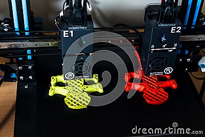 Dual extruder 3d printer which is printing two bicolor model, idex technology Stock Photo