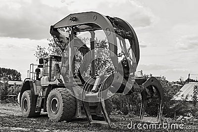 Dual function grapple skidder outdoors Stock Photo