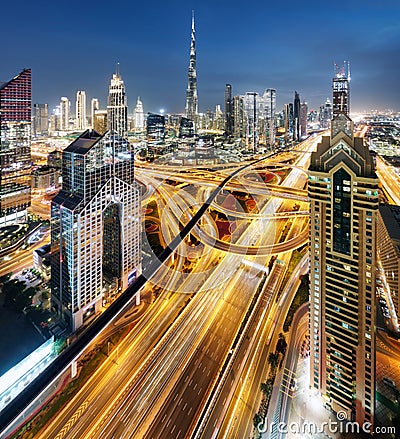 Dubai - city center skyline and bussy evening after sunset at night, United Arab Emirates Stock Photo