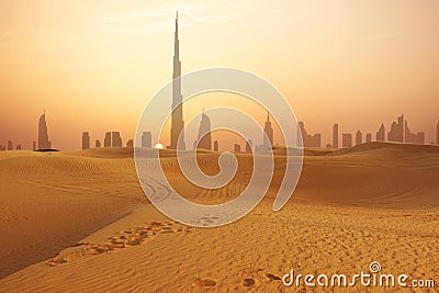 Dubai city skyline at sunset seen from the desert Stock Photo