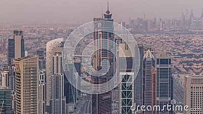 Dubai Downtown skyline futuristic cityscape with many skyscrapers and Burj Khalifa aerial timelapse. Stock Photo