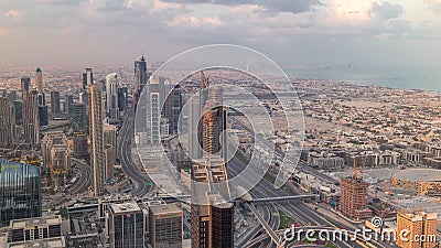 Dubai Downtown skyline futuristic cityscape with many skyscrapers and Burj Khalifa aerial timelapse. Stock Photo