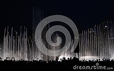 The Dubai Fountain with audience taking photograph Editorial Stock Photo