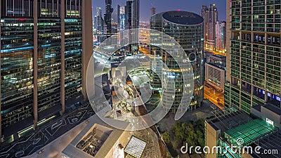 Dubai international financial center skyscrapers aerial night to day timelapse. Editorial Stock Photo