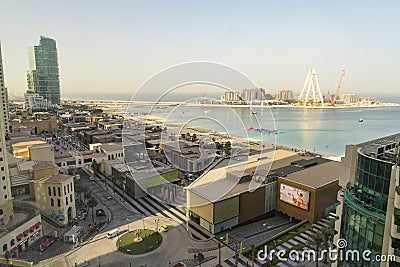 Dubai - January 30: Top view of Dubai Marina shopping mall, the walk and construction site of Dubai Eye ferris wheel on January 30 Editorial Stock Photo