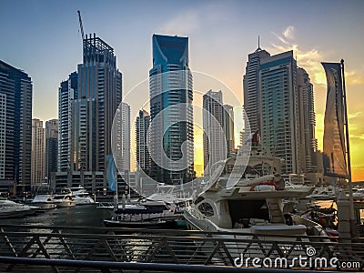 Dubai Marina boat port and towers at sunset Editorial Stock Photo