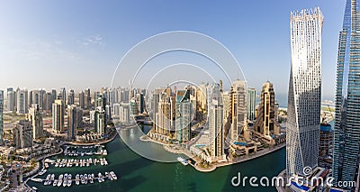 Dubai Marina and Harbour skyline architecture overview wealth luxury travel in United Arab Emirates with boats yacht panorama Editorial Stock Photo