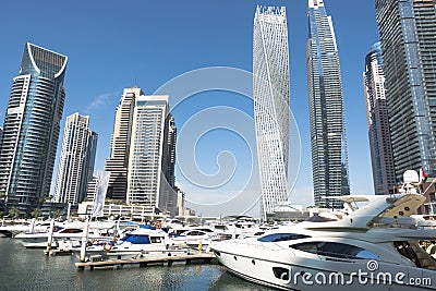 Dubai Marina with luxury skyscrapers and yachts on water pier, UAE Editorial Stock Photo