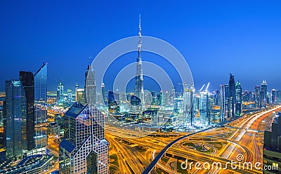 Dubai skyline at sunset with beautiful city center lights and Sheikh Zayed road traffic,Dubai,United Arab Emirates Stock Photo
