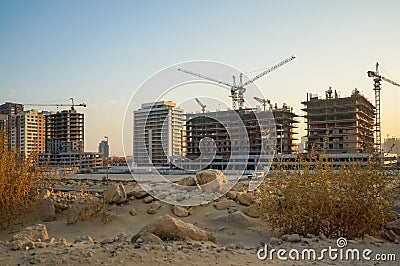 Dubai. Summer 2016. Development of desert areas, new housing in the city of Dubai, near the new hotel Ghaya Grand. Editorial Stock Photo