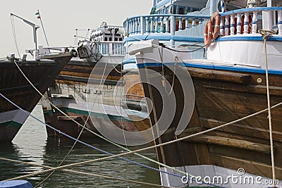 Dubai UAE Dhows old wooden sailing vessels are docked along the Deira side of Dubai Creek. Stock Photo