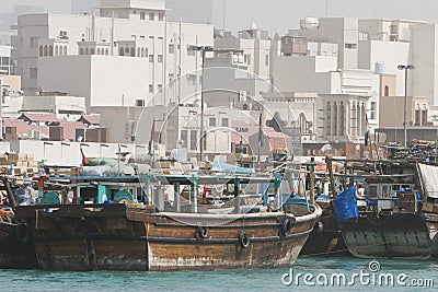Dubai UAE Dhows old wooden sailing vessels are docked along the Deira side of Dubai Creek. Stock Photo