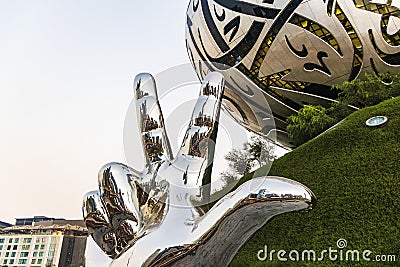 Dubai, UAE - 10.02.2022 - At the entrance of a very well known landmark Museum of Future. Win, Victory, Love sculpture. City Editorial Stock Photo