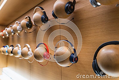 Dubai, UAE - February 2020: Beats by Dr. Dre headphones on display in Apple Store Editorial Stock Photo