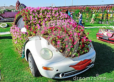 DUBAI, UAE - NOV, 2013: Fun cartoon car made with flowers at the Miracle Garden in Dubai. United Arab Emirates Editorial Stock Photo