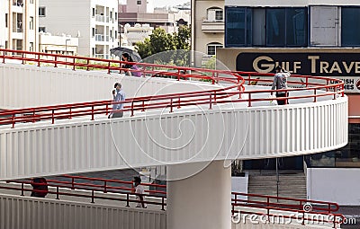 Dubai, UAE - 07.14.2021 People using foot cross bridge to cross the road. Outdoors Stock Photo