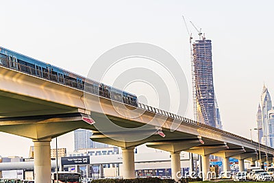 Dubai, UAE - 21.06.2023 - Shot of the train leaving Business Bay metro station. City Editorial Stock Photo