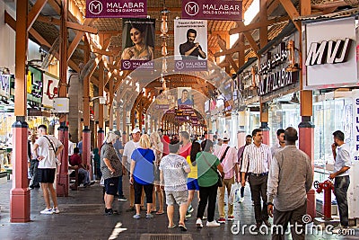 Dubai, UAE - 12th october, 2022 : people tourist walk sightseeing old gold souk in old Dubai. Famous attraction and landmark in Editorial Stock Photo