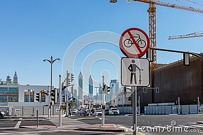 Dubai, United Arab Emirates - December 12, 2018: sign for cyclists at a pedestrian crossing Editorial Stock Photo