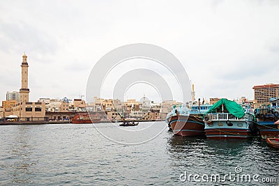 DUBAI, UNITED ARAB Dubai creek, ancient buildings and canal with abra and dhow traditional boats Editorial Stock Photo