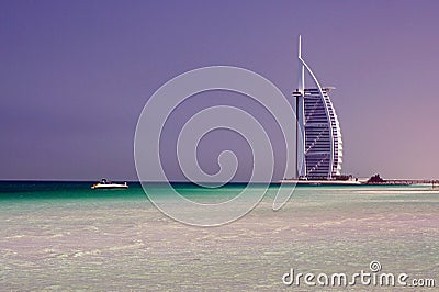 DUBAI, EMIRATES - MARCH 17. 2009: View on Burj Al Arab Tower over white sand and turquoise water Editorial Stock Photo