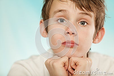 Dubious young boy with a sceptical expression Stock Photo