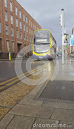 Dublin Bus vehicle over wet streets, Ireland Editorial Stock Photo