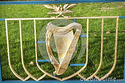 DUBLIN.IRELAND - December 07 , 2018:The golden Irish harp on the background of green grass Editorial Stock Photo