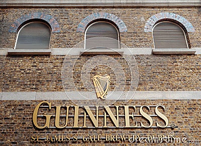 Dublin, Ireland - 07.12.2023:Dublin, Ireland - 07.12.2023: Guinness sign on a wall of a Guinness brewery and museum. Popular Editorial Stock Photo