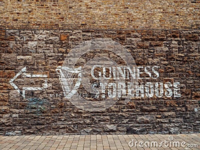 Dublin, Ireland - 07.12.2023: Guinness sign on a wall of a Guinness brewery and museum. Popular travel area and capital landmark Editorial Stock Photo