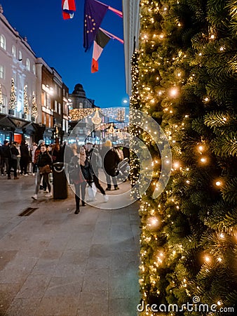 Dublin, Ireland - 20.12.2022: Lights on a fur tree decoration and Decorated and illuminated Grafton street in the Irish capital Editorial Stock Photo