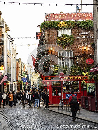 Dublin, Ireland - 20.12.2022: Popular Temple bar decorated for Christmas and new Year celebrations. Most photographed pub in the Editorial Stock Photo