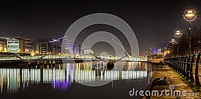 Dublin Ireland River Liffey at Night with harp bridge reflections UK Editorial Stock Photo
