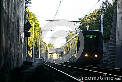 Beautiful view of Luas tram entering Balally Luas stop in the autumnal morning Editorial Stock Photo