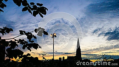 Dublin Skyline silhouette at sunset St. Laurence O`Toole church Editorial Stock Photo