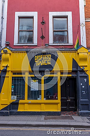 Dublin, a street view of closed Drop Dead Twice with gray and yellow colours Editorial Stock Photo