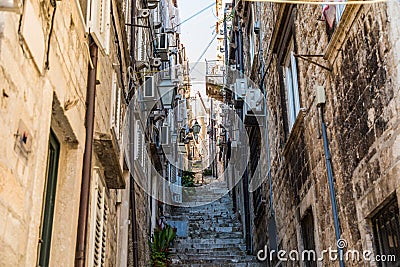 Dubrovnik, Croatia - July, 2019: Picturesque narrow street in Dubrovnik, Croatia. Dubrovnik joined the UNESCO list of World Editorial Stock Photo