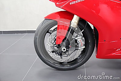 Ducati Panigale 1299: Close-up of the wheel, fairing red color, Editorial Stock Photo