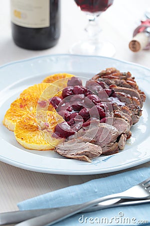 Duck meat with orange and cherry sauce Stock Photo