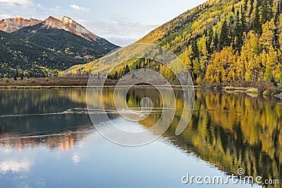 Duck Ripples on Serene Crystal Lake Stock Photo