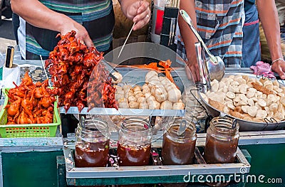 Ducklings on skewers and fish flour balls Stock Photo