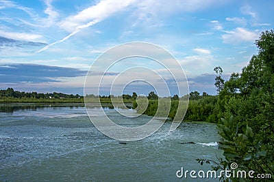 Duckweed covered lake kiovo, moscow region, russia, Orthodox church on the shore overgrown with reeds at summer evening Stock Photo