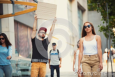 Dude with sign - man stands protesting things that annoy him Stock Photo