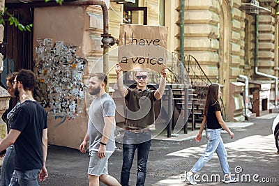 Dude with sign - man stands protesting things that annoy him Stock Photo
