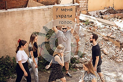 Dude with sign - man stands protesting things that annoy him Stock Photo